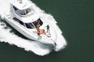 Group of people on speedboat at sea, aerial view